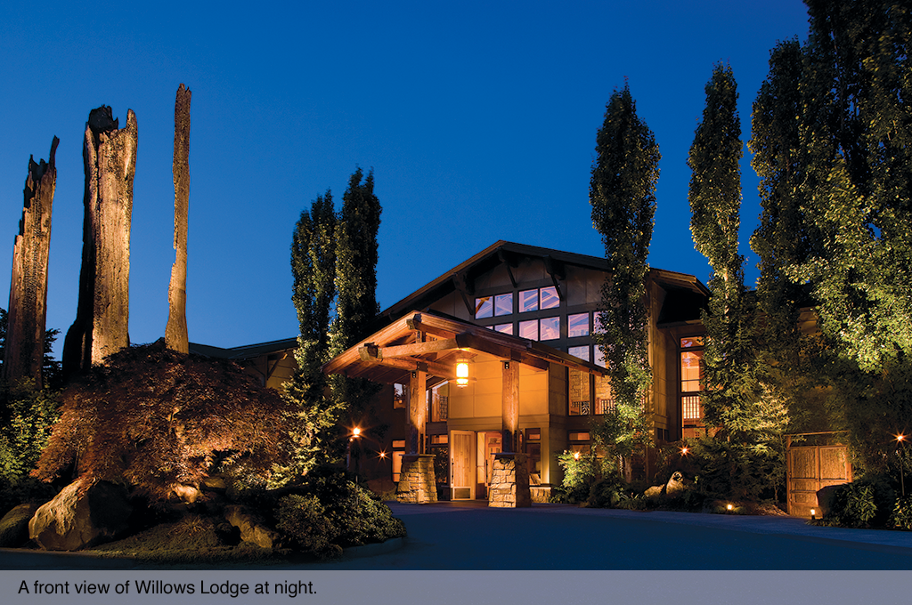 A nighttime view of the Willows Lodge front entrance.